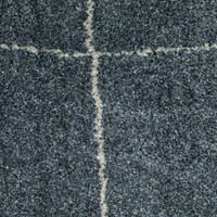 Alton Blue & Beige Casual Rug, close-up of dense, power-loomed polyester yarn with a white grid pattern.