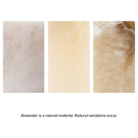 Three rectangular samples of alabaster stone, showing natural variations from light white to warm brown.