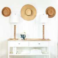 Natural Perennial Buffet Lamps with white linen shades on a white console table with coastal decor.