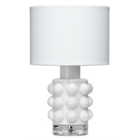 White Seltzer Mini Table Lamp with a textured glass base, clear glass stand, and off-white linen drum shade.