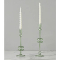 Pair of large sage green glass candlesticks with white twisted taper candles.