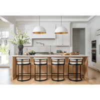 Large white dome pendant light with a gold interior, hanging over a kitchen island.