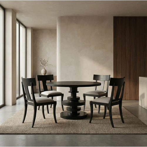 Round mahogany dining table in hand-rubbed black with a stacked pedestal base, surrounded by four matching chairs.