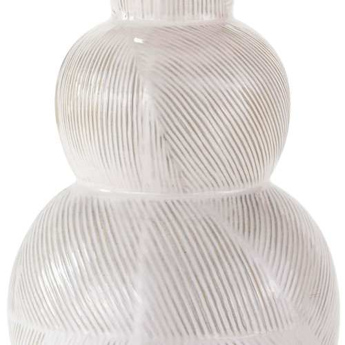 Hugo ceramic table lamp with a textured white earthenware base and subtle highs and lows.