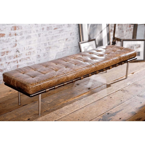 Modern tufted brown leather bench with chrome legs and dark wood straps.