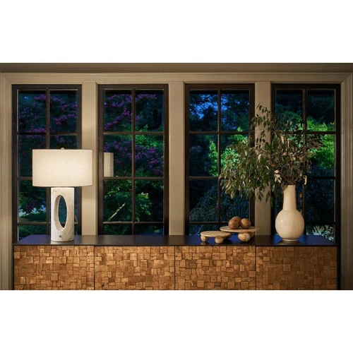 Marlow brown marble plate on a wooden console with a lamp and vase.