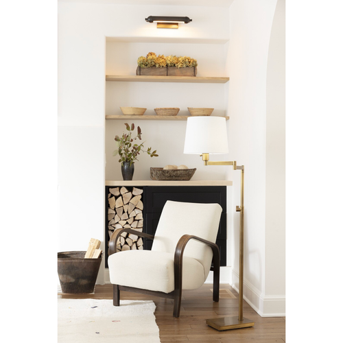 Devon Picture Light Large Oil Rubbed Bronze illuminating a built-in shelf with decor.