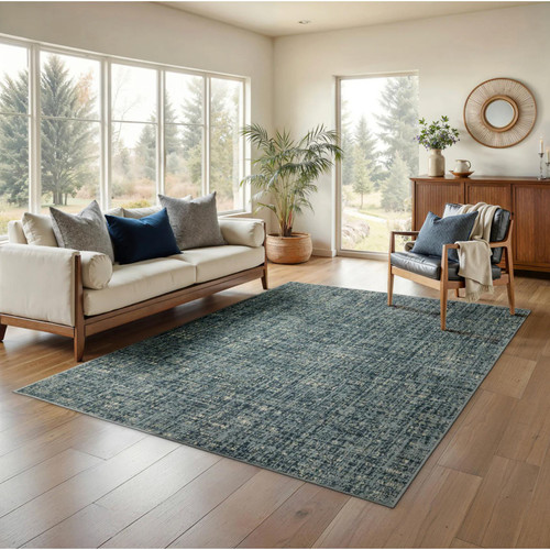 Branson Blue Abstract Rug, power-loomed polypropylene with textured, tri-colored yarn, in a modern living room.