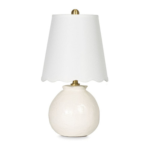 Amoria Mini Lamp with a white ceramic body, natural brass hardware, and a wavy scallop-like linen shade.