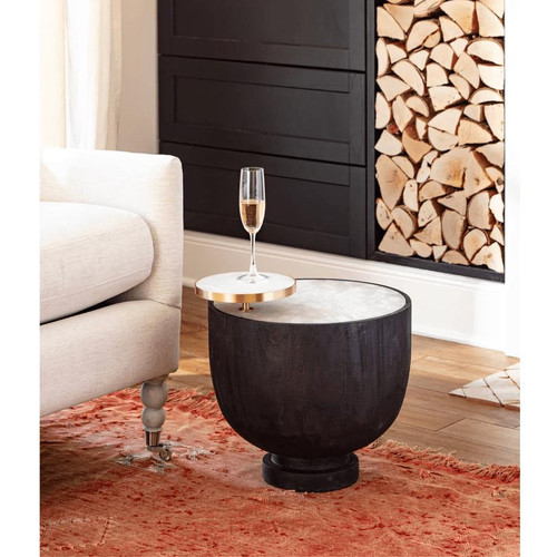 Ebony Theo accent table with a round alabaster top and a smaller brass-rimmed alabaster tray.
