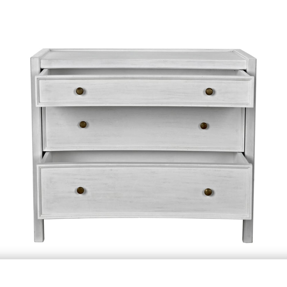 White hand-carved mahogany Hampton side table with three open drawers and metal pulls.