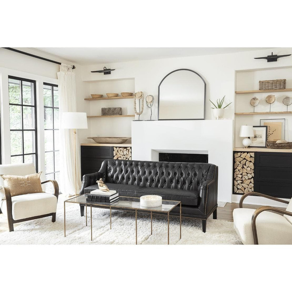 Elegant Fisher Floor Lamp with gold-leaf body, natural alabaster base, and linen shade in a living room.