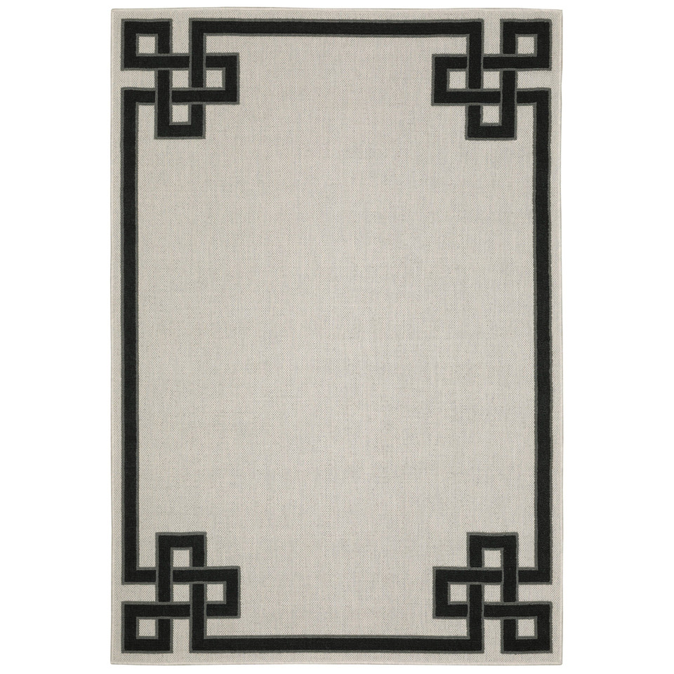 Torrey Beige & Black Outdoor Rug with a flatwoven base and black geometric loop pile border.