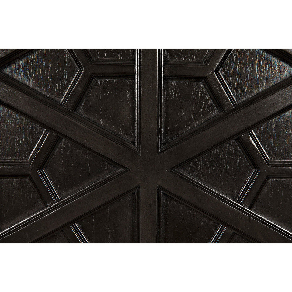 Close-up of a dark burnished mahogany hutch door with intricate geometric hand-carving.
