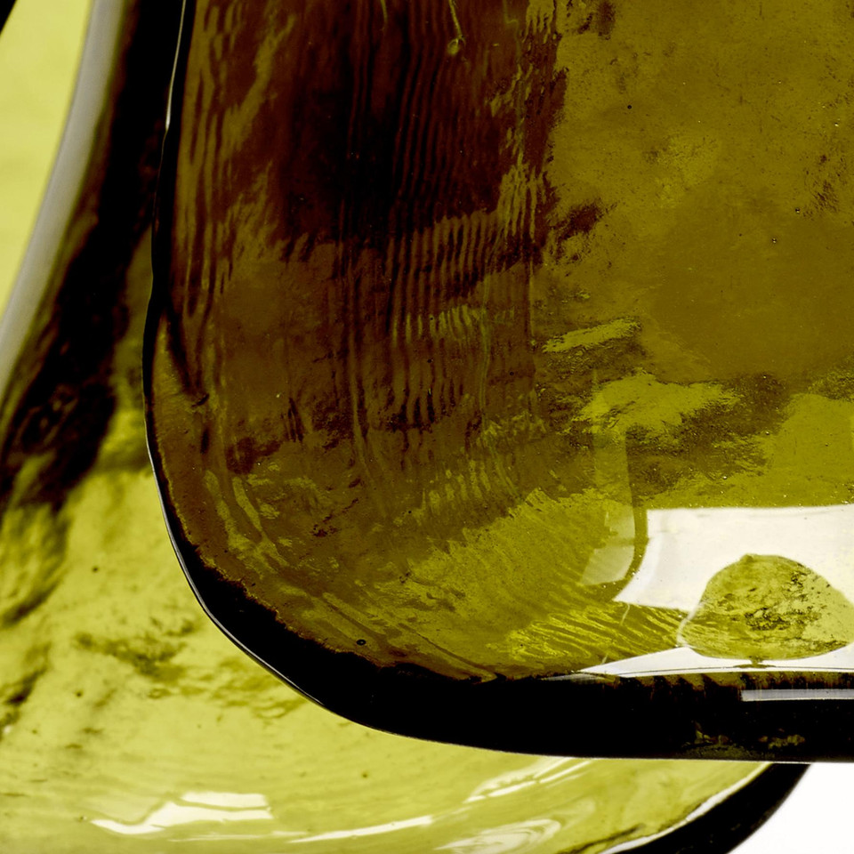 Close-up of a Calla Peridot Green Glass Pendant, showcasing its hand-blown, artisan-crafted glass shade.