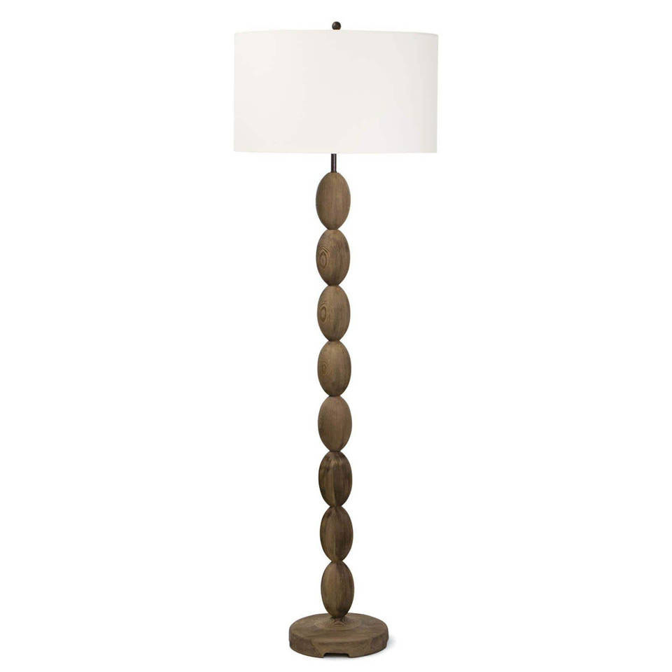 Buoy floor lamp with a birch wood base featuring stacked oval shapes and a white linen drum shade.