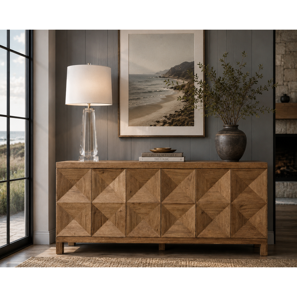 Dark walnut sideboard with three geometrically carved doors, styled in a modern living room.