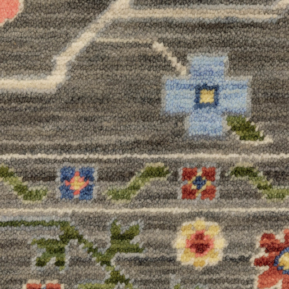 Close-up of Lucca Grey & Multi Traditional Rug, showing cross-woven wool/nylon with floral patterns.