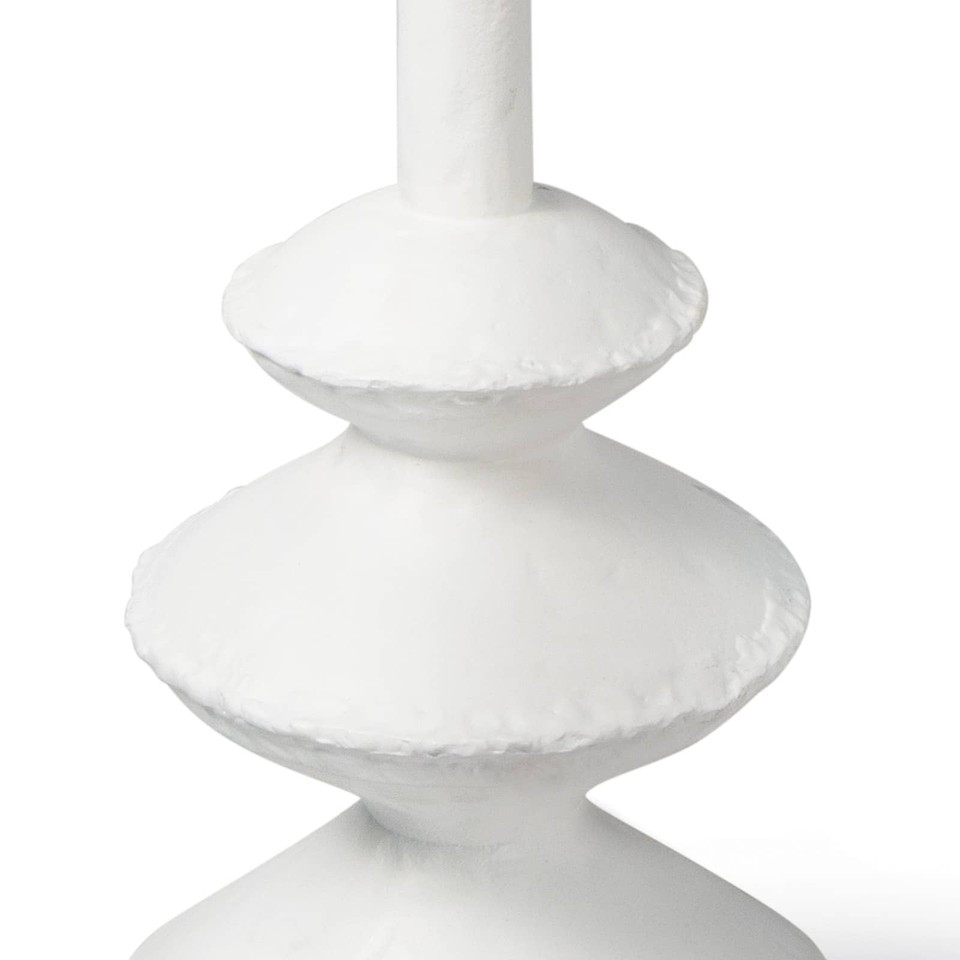 Matte white accent table with complex, paper mache-inspired curves and unique texture.