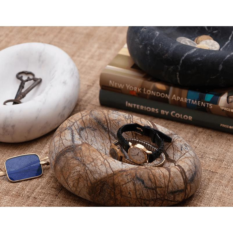 Lagoon Marble Bowl, a natural stone decorative bowl with unique veining, holding a watch.