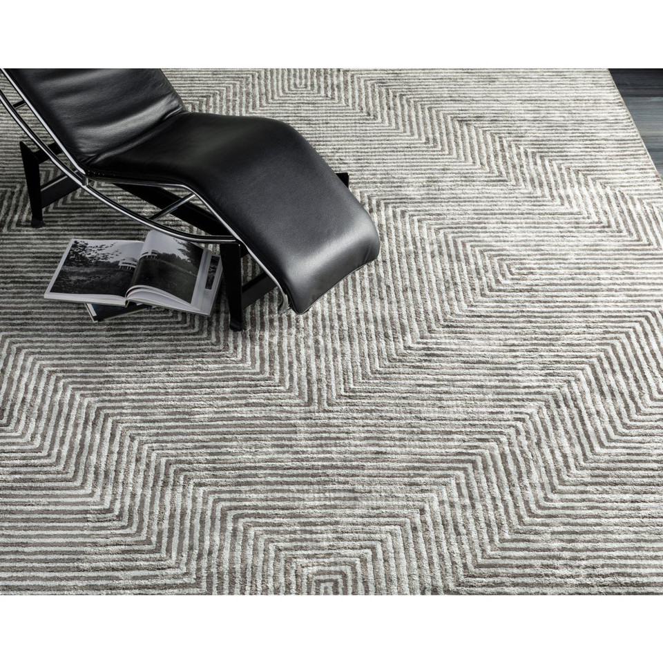 Charcoal grey and light grey striped viscose rug with a modern geometric pattern.