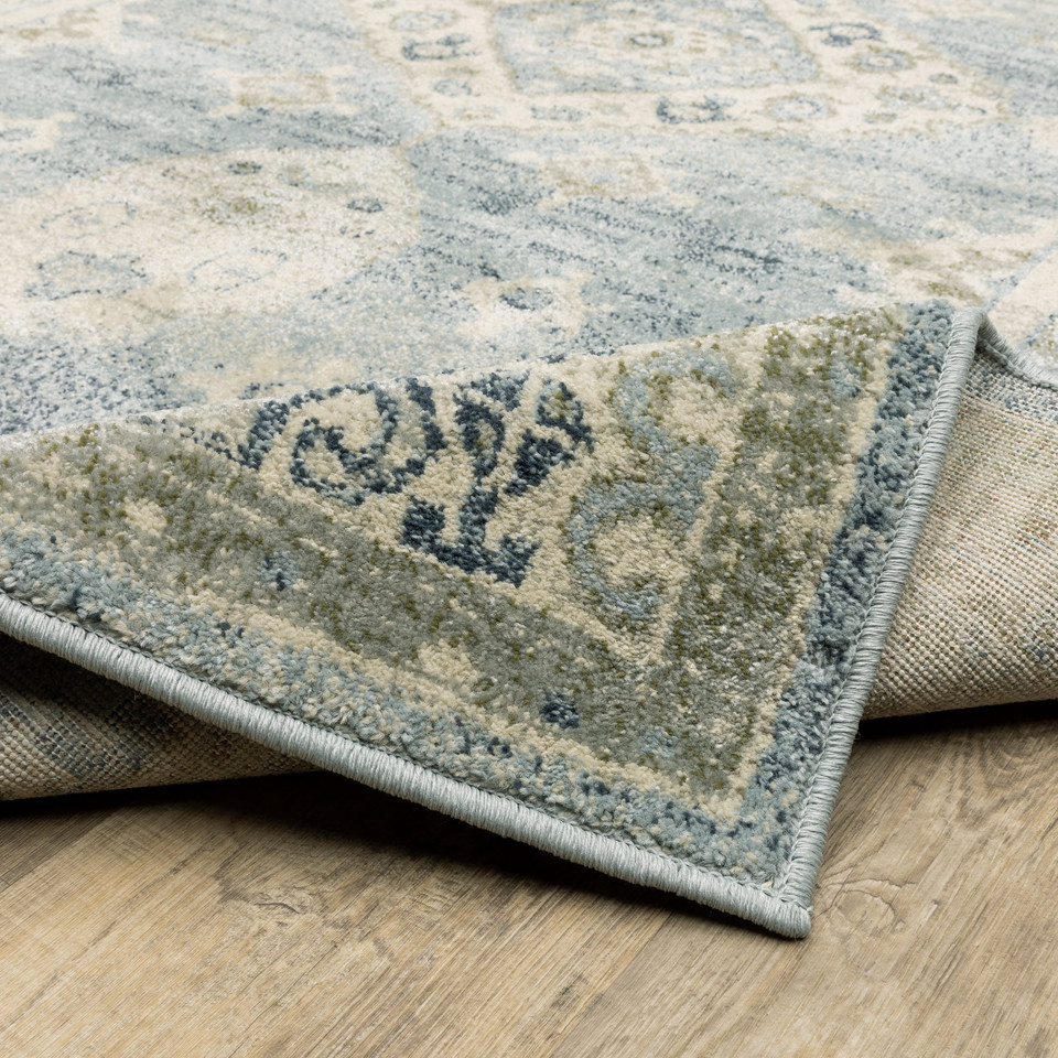 Branson Blue & Beige Traditional Rug, power-loomed polypropylene with classic design, curled corner showing woven back.