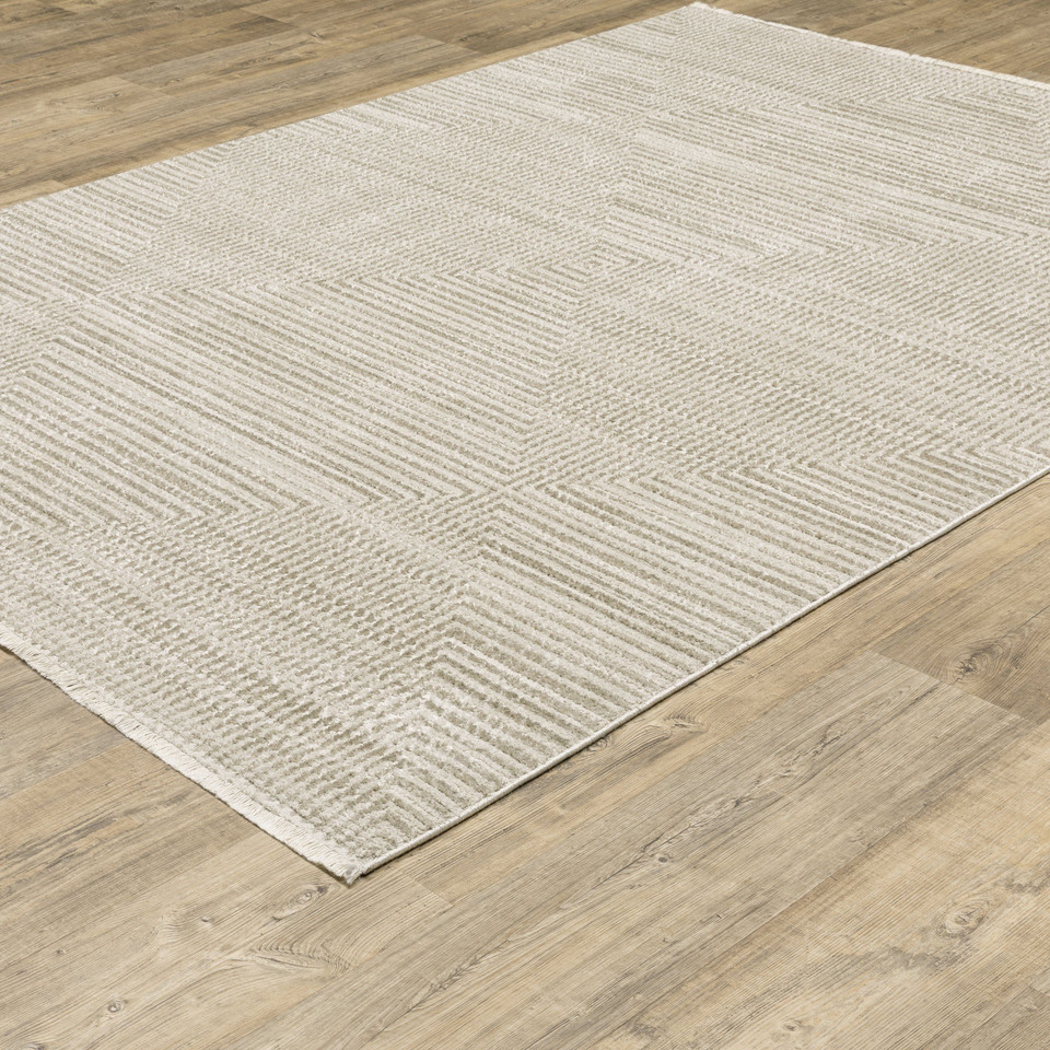 Bauer Beige & Ivory Casual Rug, 100% recycled PET yarn, with a subtle geometric pattern on wood floor.