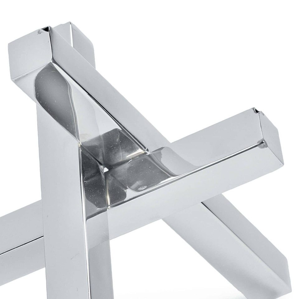 Polished nickel intersecting sculpture with an industrial vibe, featuring reflective surfaces.