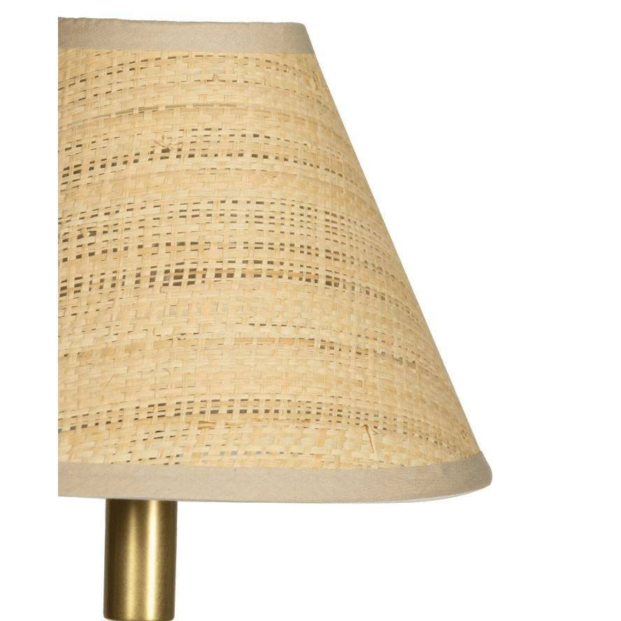 Polly Buffet Lamp with a natural rattan shade and a brass-finished base, casting a warm glow.