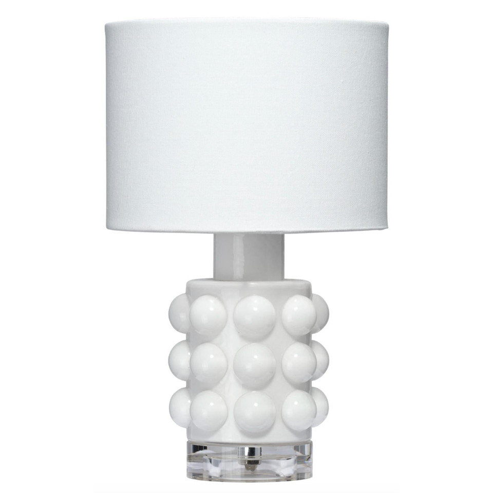 White Seltzer Mini Table Lamp with a textured glass base, clear glass stand, and off-white linen drum shade.