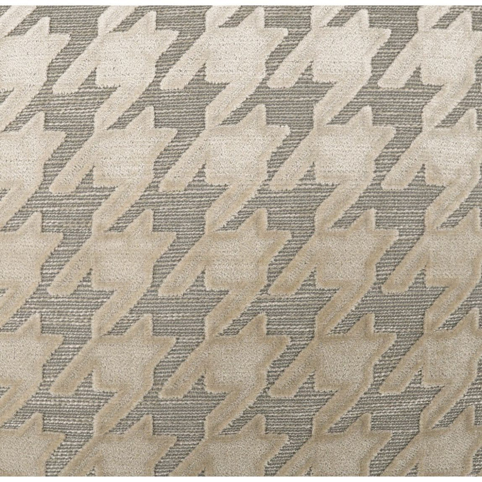 Beige mist throw pillow with a raised houndstooth pattern on a textured gray background.