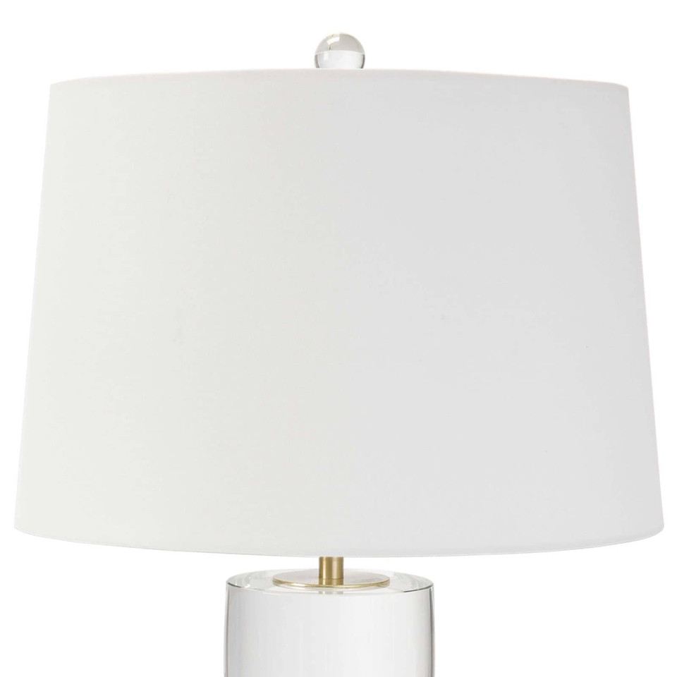 Joan large crystal table lamp with a white linen shade and natural brass accents.
