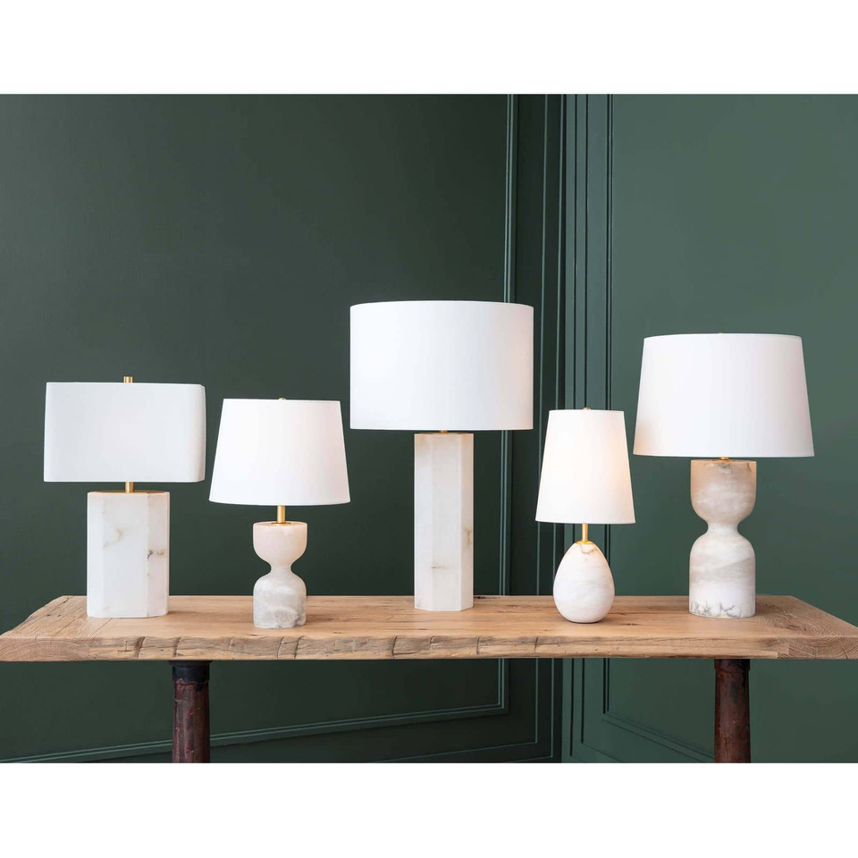 Jared Alabaster Mini Lamp with an oval alabaster base and elongated white linen shade.