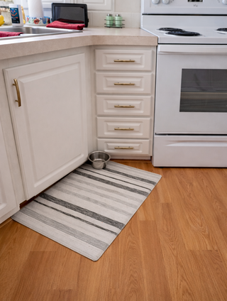 After photo showing updated silver hardware on cabinet doors