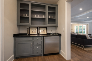 Custom built-ins entertainment center for niche wall with cabinetry and shelving