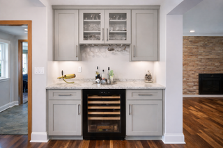 custom built ins light grey shaker bar with glass ready doors and shaker drawer fronts