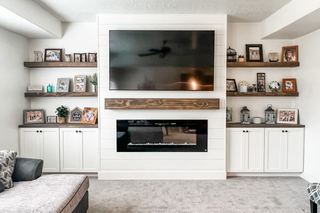custom built ins with white shaker doors in a rustic interior
