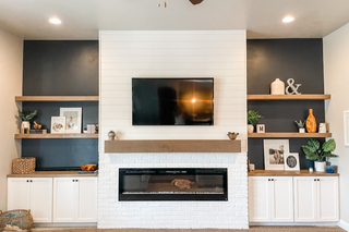 custom built ins with white shaker doors and wood floating shelves