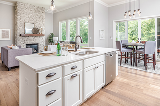 Custom kitchen island with white shaker panels for a timeless island centerpiece with storage