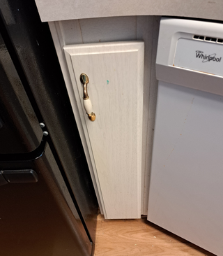 Before view of the cabinet run near the stove