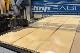 UV maple cabinet components on CNC table