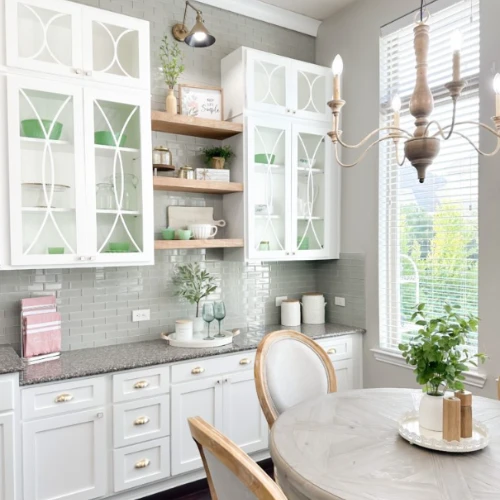 Roxanne's unfinished shaker cabinet doors open for glass