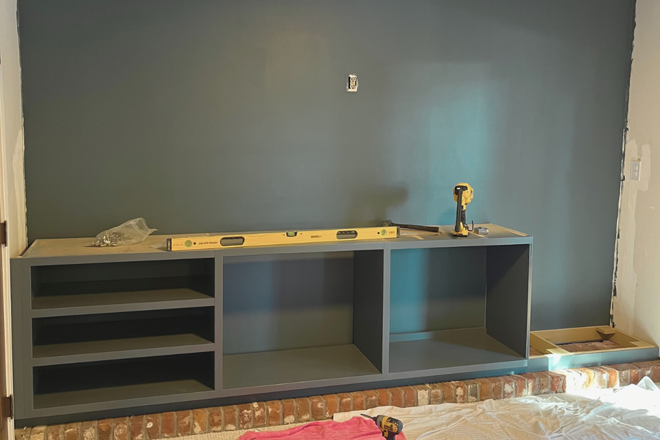 Custom built-in cabinets and shelving detail in Charles’ real life entertainment center project