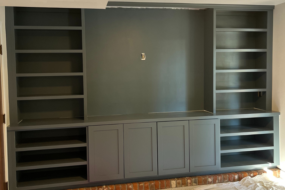 Custom built-in entertainment center cabinetry with full overlay shaker doors in Charles’ real life project