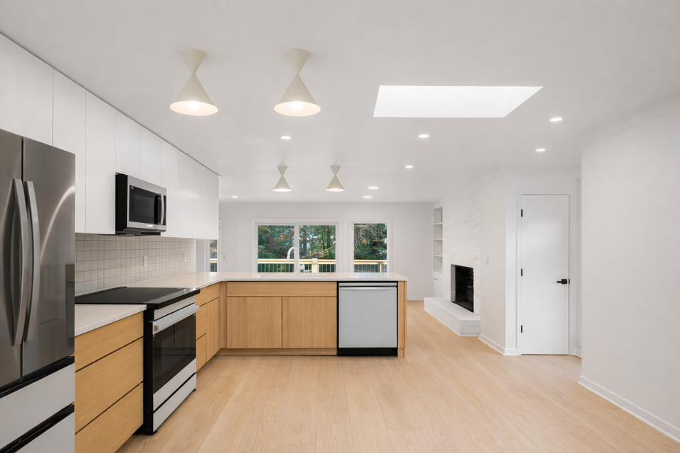 Scandinavian-inspired custom kitchen cabinets with Modern Turino slab doors and white countertops final view