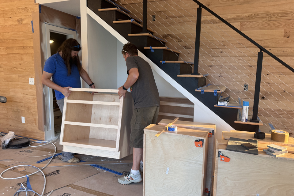 Custom built-in real life project showing satin black kitchen cabinets and layout details