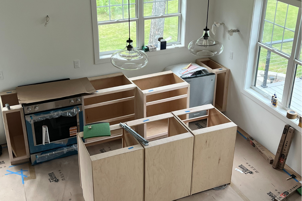 Custom built-in kitchen cabinets with RTA cabinet boxes and shaker thermofoil doors in Mary Jo’s real life project