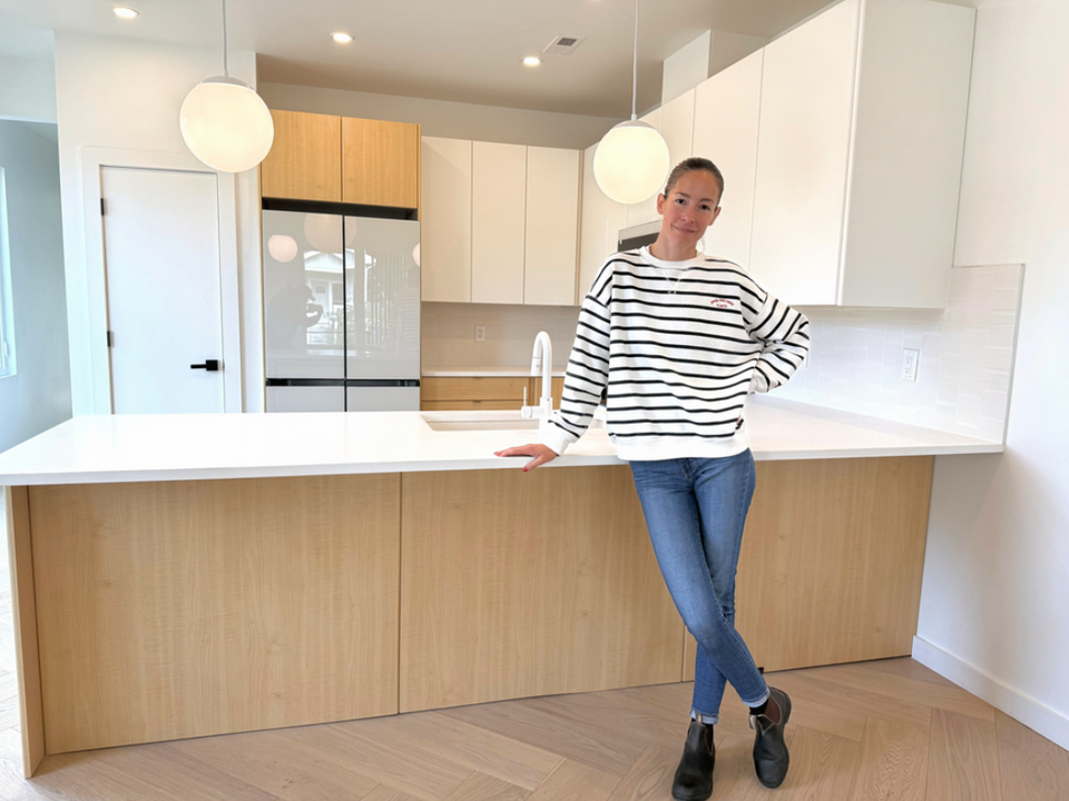 Modern thermofoil slab cabinet doors in a contemporary kitchen featuring white and natural wood grain flat panel cabinet doors with custom replacement cabinetry.