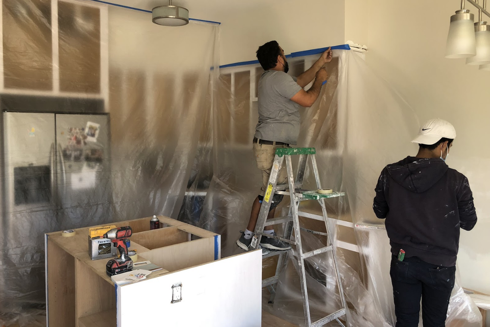 Custom kitchen cabinets layout showing refaced cabinetry and new island storage in Stephen project