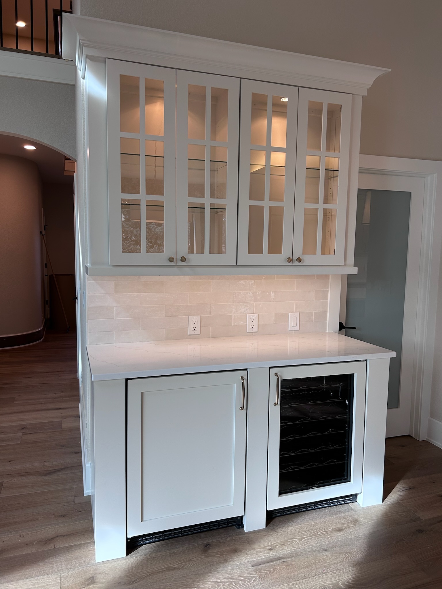 Custom glass cabinet doors in modern shaker kitchen